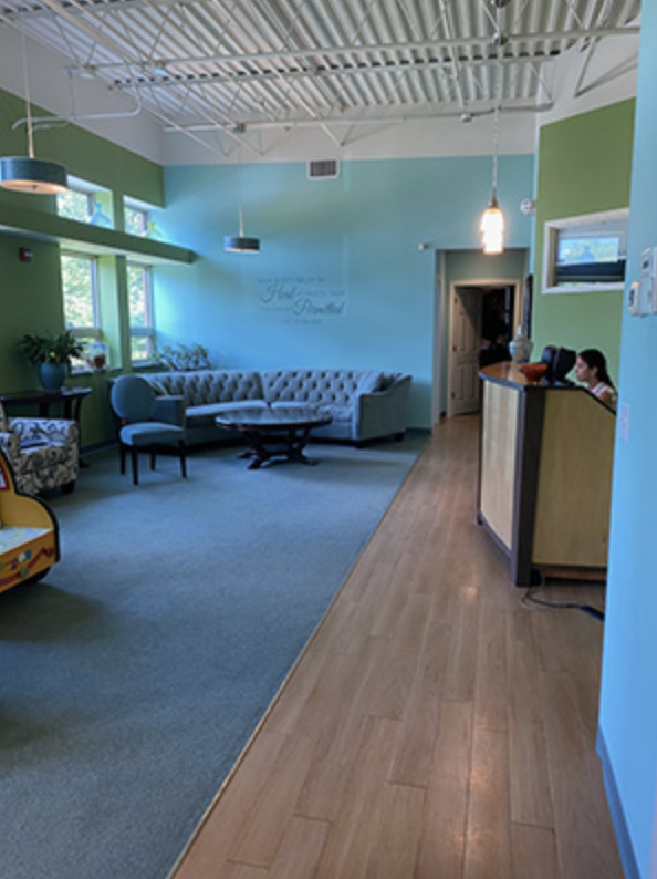 Wide view of the reception area looking toward the front desk
